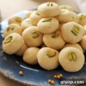 Ghraybeh Cloud Cookies 2 A pile of ghraybeh on a blue plate.