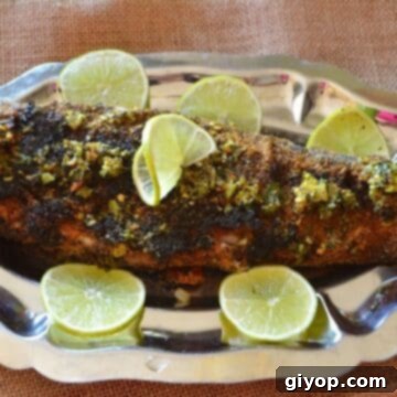 Grilled Trout: Simple, Healthy, Delicious 2 A grilled trout on a silver serving platter with lemon rinds.