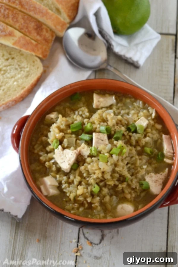 A bowl of food on a table, with Freekeh Soup