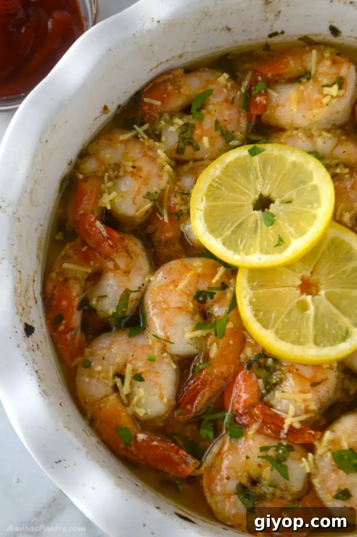 Golden Garlic Shrimp Bake 2 An overhead image with a baking dish with shrimp.