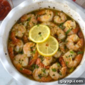 Golden Garlic Shrimp Bake 5 White baking dish with shrimp scampi.