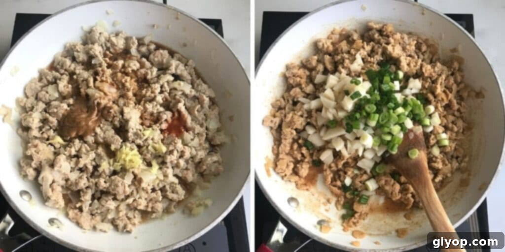 The cooked chicken lettuce wrap filling, showcasing crunchy water chestnuts and fresh green onions.