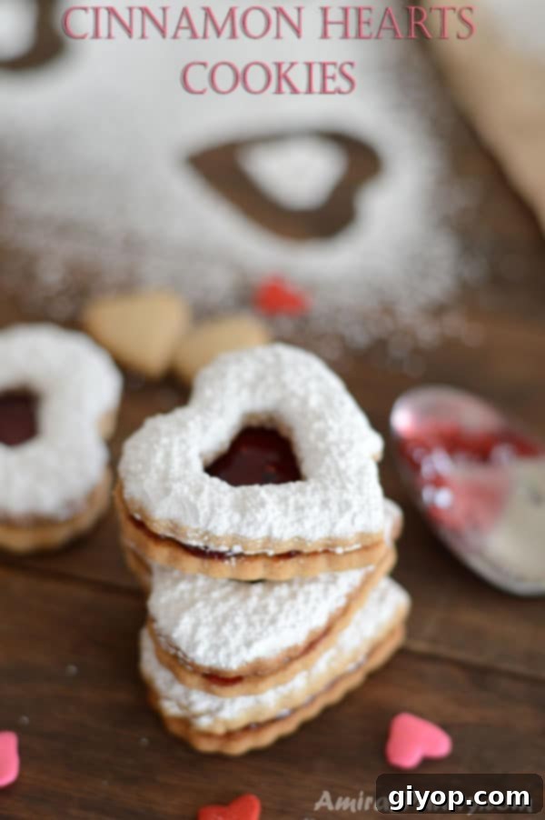 A close up of a heart cookie with sugar on top, signifying a sweet homemade treat.