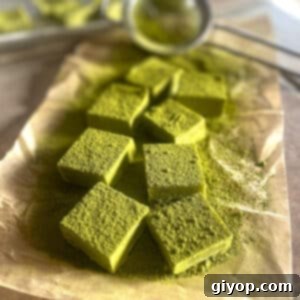 Emerald Cacao Fusion 6 Matcha chocolate on parchment paper dusted with matcha powder, ready to be cut into squares.