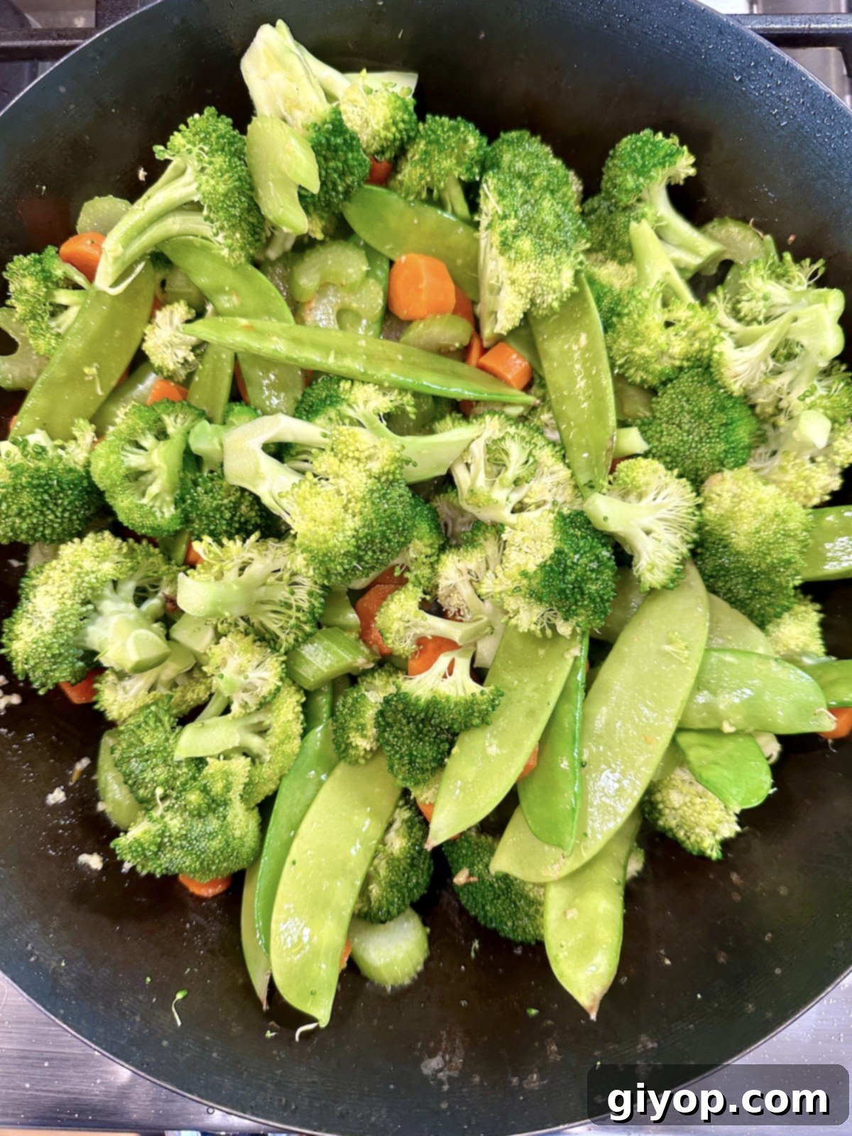 Cooked vegetables in a pan.