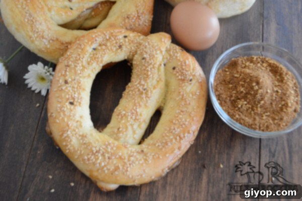 Egypt's Iconic Sesame Rings 5 Close-up of Egyptian Simit bread with a wooden table background, spices and a boiled egg.