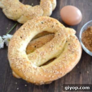Egypt's Iconic Sesame Rings 6 Egyptian simit on a wooden table with eggs, ready to be served.
