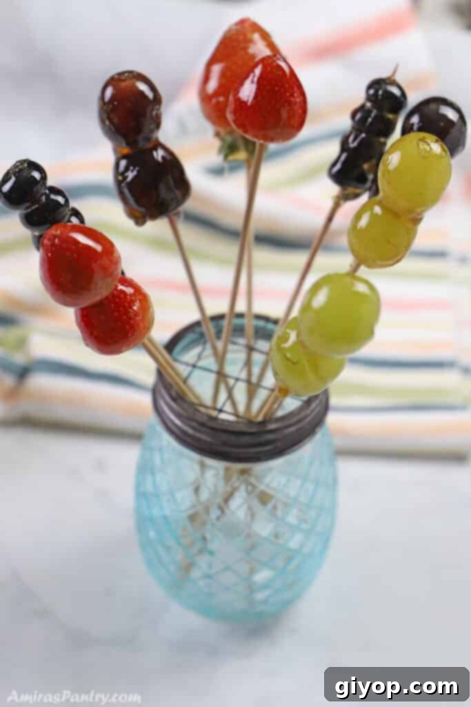 Meal Plan 8 7 Colorful and glistening Tanghulu skewers, featuring various candied fruits, artfully arranged in an elegant blue vase and placed on a pristine white marble surface, inviting indulgence.