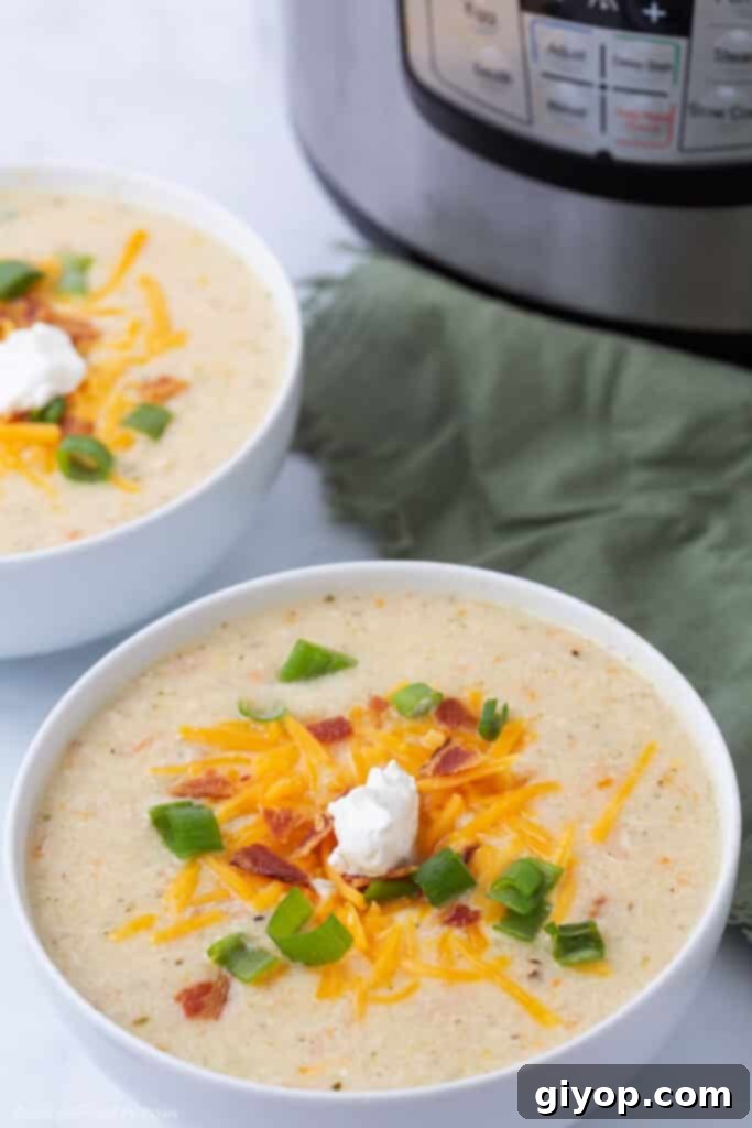Elevated Eating Guide 2 Two warm bowls of creamy potato soup, garnished with fresh herbs, with an Instant Pot visible in the soft-focus background, suggesting an easy preparation.