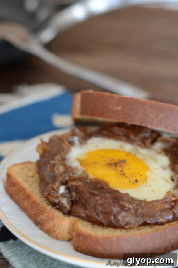 A close up of a sandwich with Date paste and eggs, showcasing a unique sweet and savory combination.