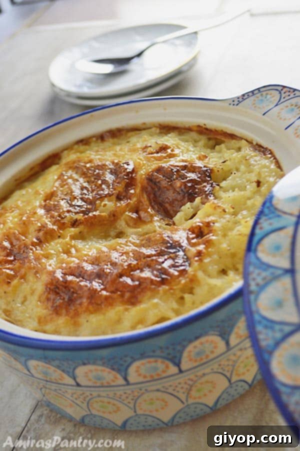 A close up of a bowl of food, with Rice pudding