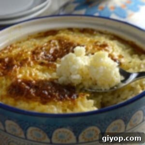 A clay pot with baked rice and chicken.