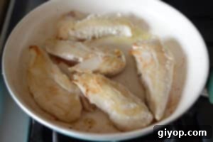 A bowl of chicken meat on a table
