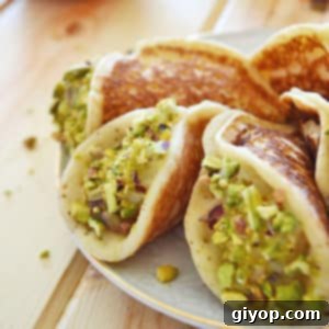 A plate of food, with Qatayef