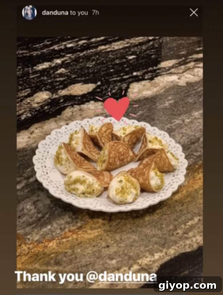 Another close-up of fan-made stuffed Qatayef, highlighting the creamy filling and garnish.