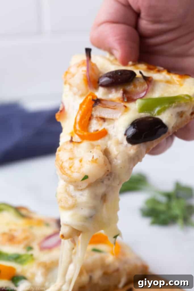 Your 28-Day Eating Guide 2 Hand pulling a slice of pizza, showcasing gooey cheese and delicious toppings.