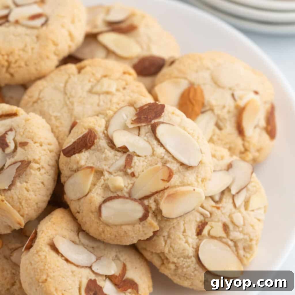 A white plate with almond cookies.