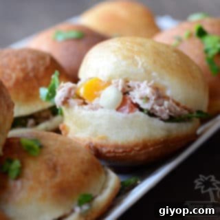 A close up of food, with bread stuffing Tuna