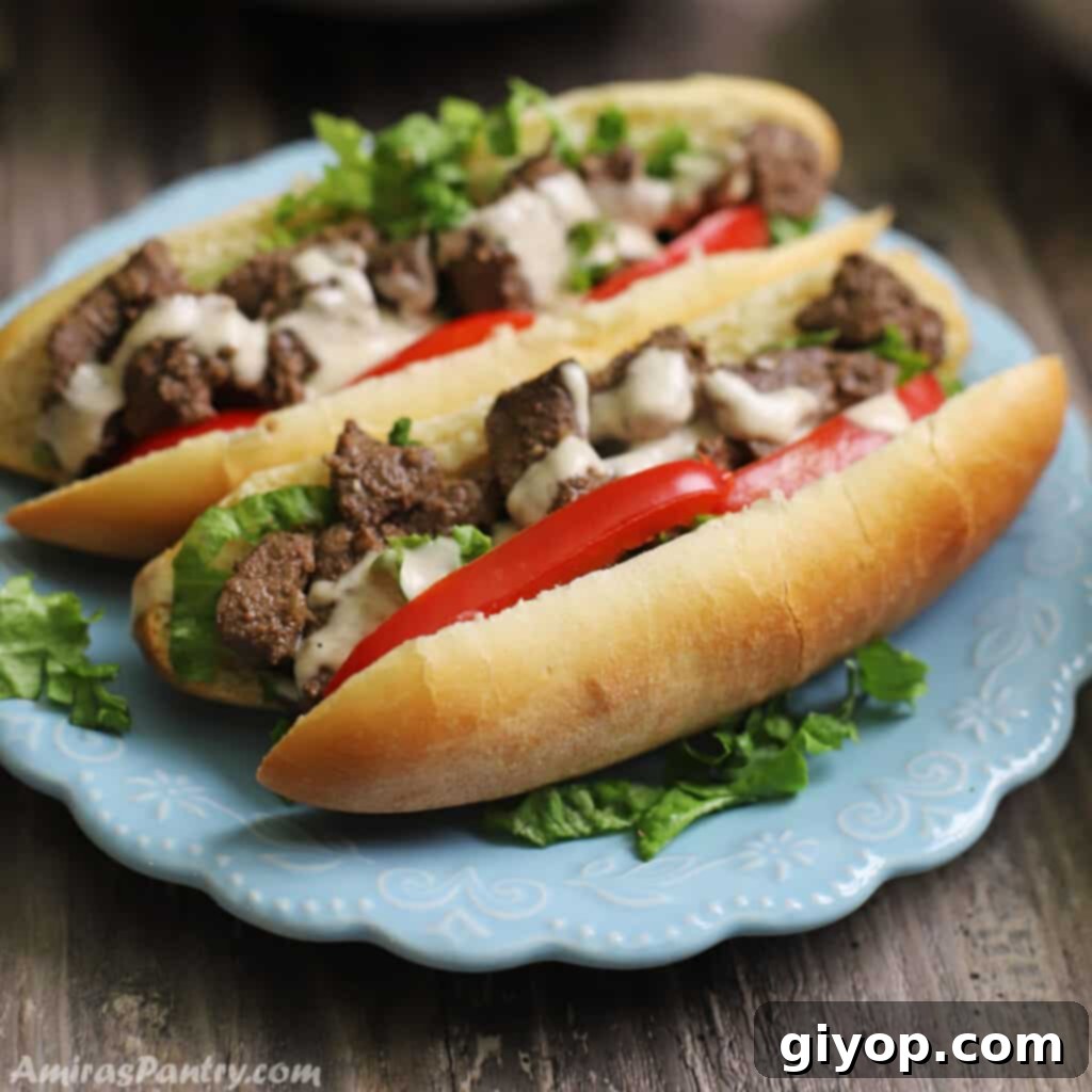 Two enticing liver sandwiches, garnished with crisp lettuce and a drizzle of creamy tahini sauce, presented on a vibrant blue plate.