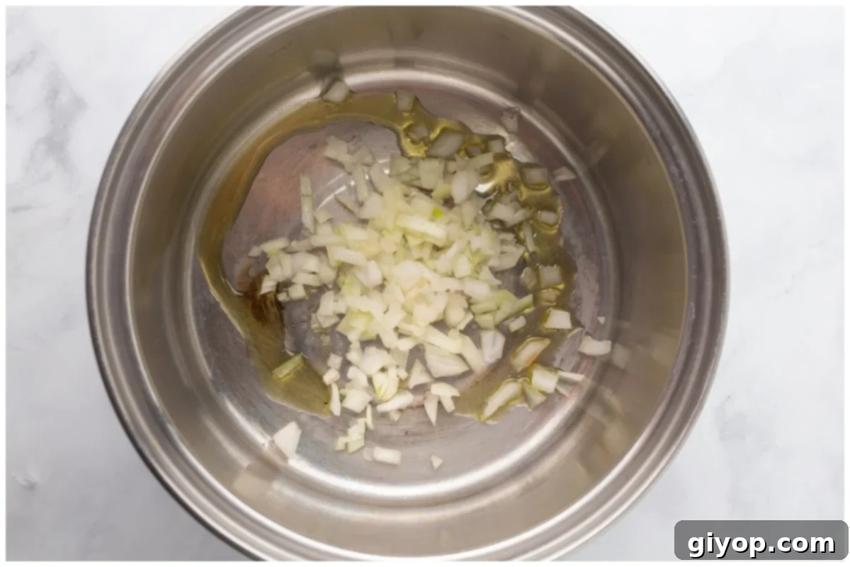 A pot with onions and oil.