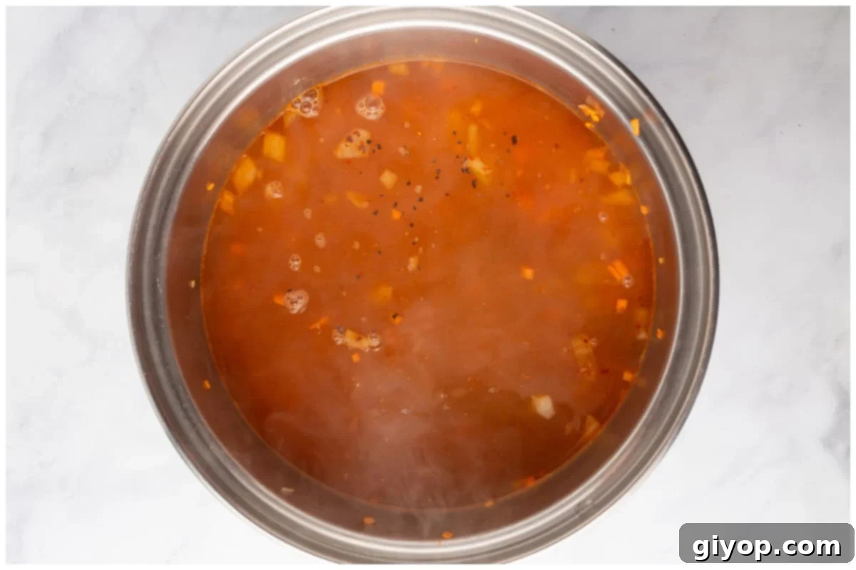 A pot with lentils and water.