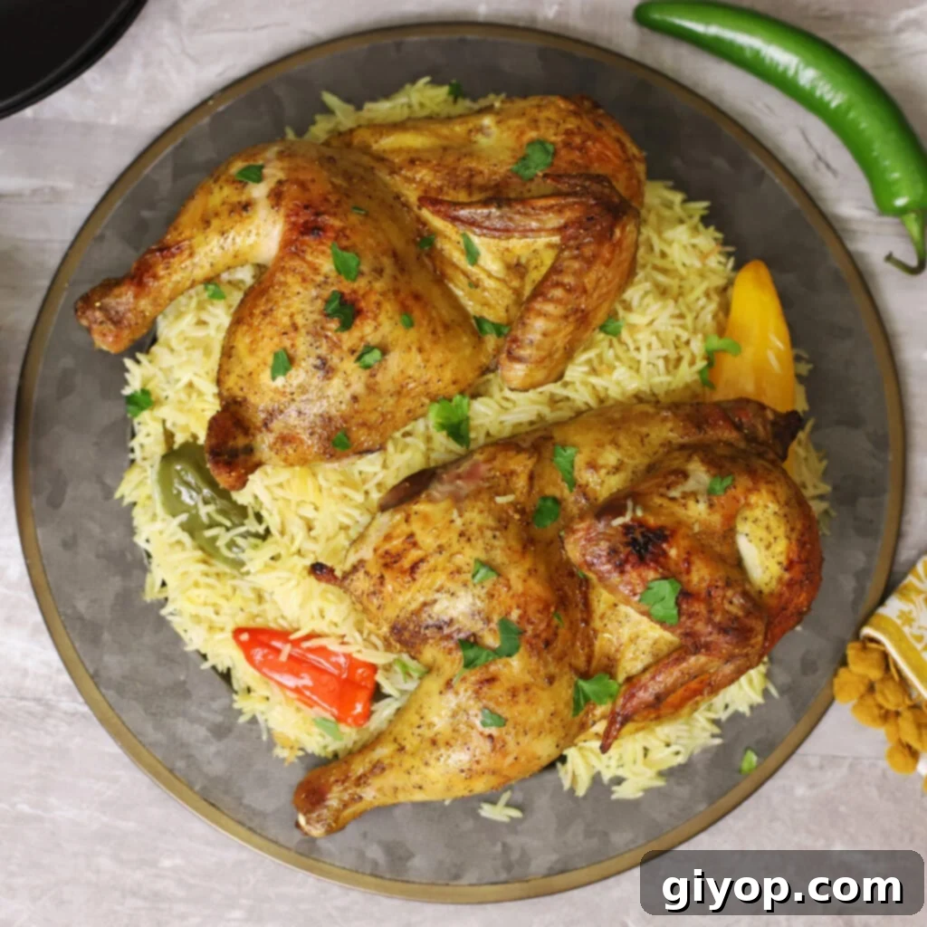 A big serving platter of Chicken Mandi, garnished generously with chopped parsley, showcasing a vibrant and appealing presentation.