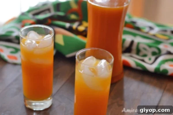 A glass of Amardeen (apricot drink) ready to be served, highlighting its refreshing color.