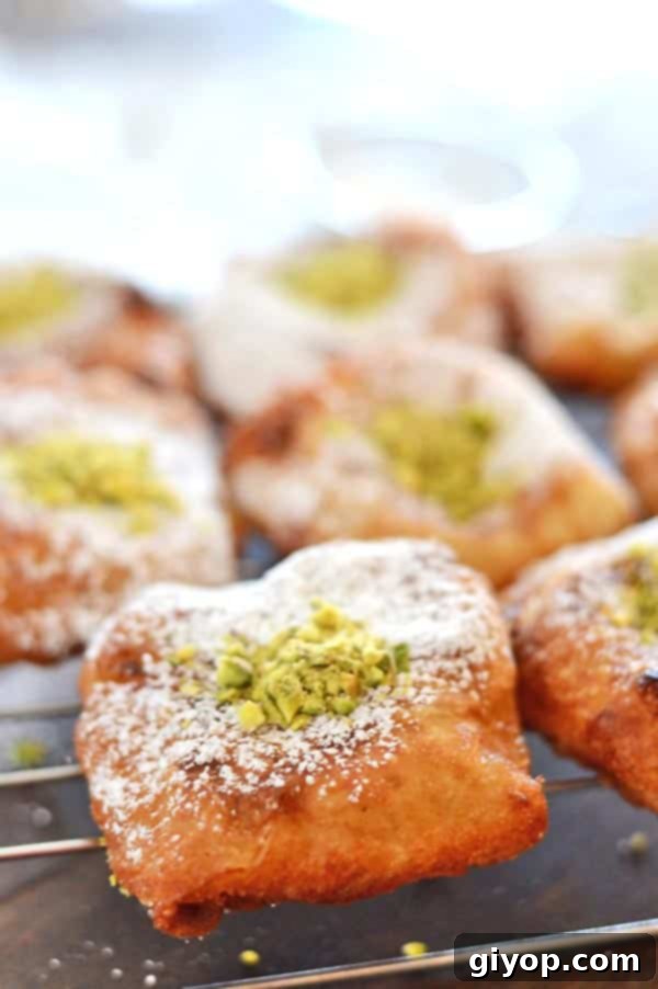 A close up of multiple pieces of Nabulsi Tamriyeh, showcasing their perfect golden color and sugar dusting.