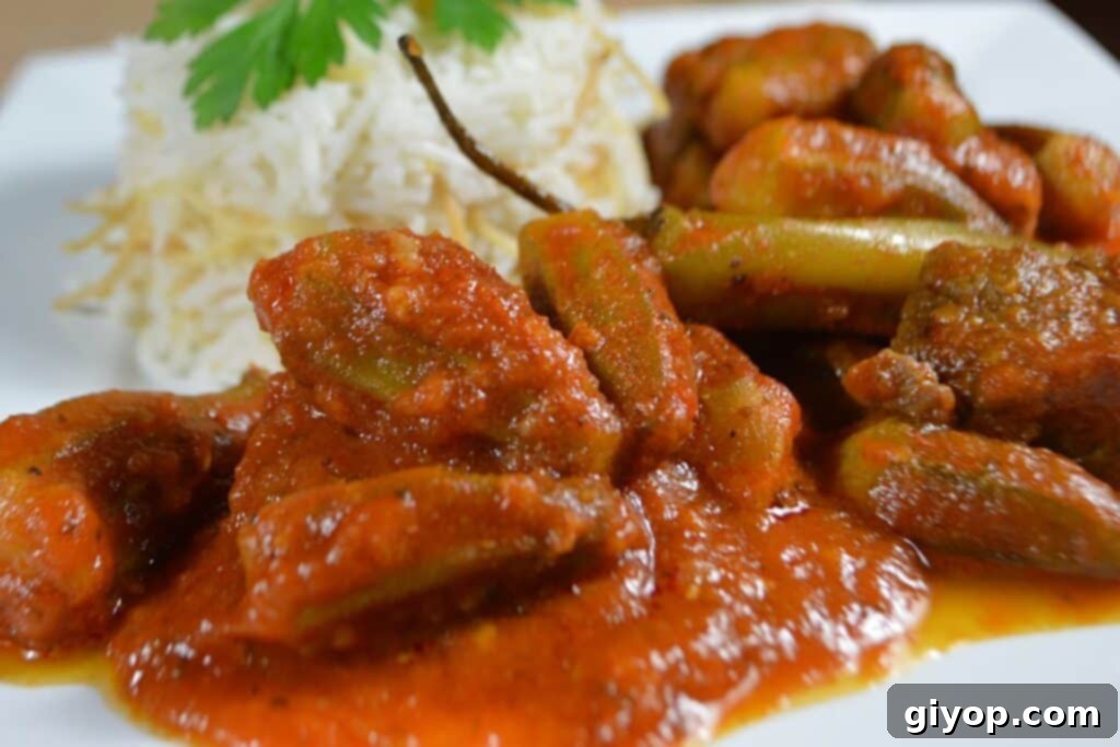 Strategic Meal Planning 5 A rich, savory okra stew served with a portion of fluffy white rice, ready to be enjoyed as a comforting meal.