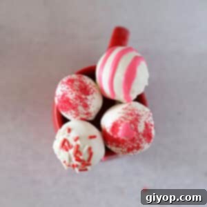 Strawberry Dream Pops 2 A top view of cake pops in a red mug.