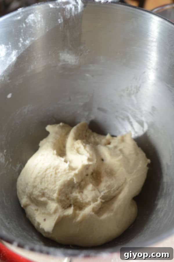Crispy Sesame Breadsticks 4 A metal bowl showing a well-kneaded dough for Egyptian breadsticks.