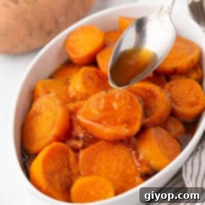 Stovetop Caramelized Sweet Potatoes 2 A spoon drizzling some sauce over candied sweet potatoes.