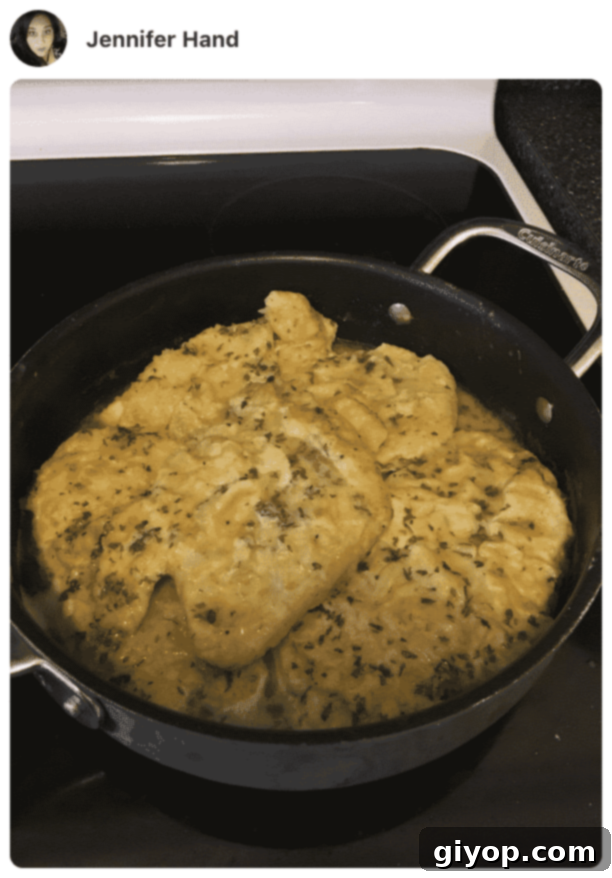 Flavorful Chicken Francese No Wine Required 9 Close-up of Chicken Francese cooking in a skillet, showcasing the golden crust and simmering lemon-butter sauce.