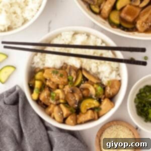 An overhead image with a rice bowl topped with some panda express chicken.