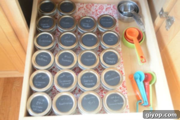 Spice Cabinet Organization Hacks 9 Organized spice jars in a kitchen drawer