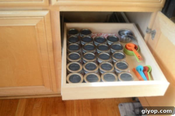 Spice Cabinet Organization Hacks 10 Spice jars and measuring tools organized in a kitchen drawer