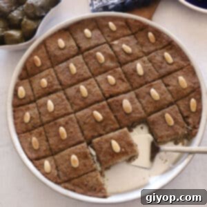 An overhead image of baked kibbeh in a metal baking dish.