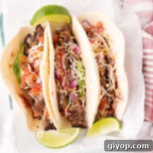 Fiesta Flank Steak Tacos 2 Overhead image of a platter of flank steak tacos.