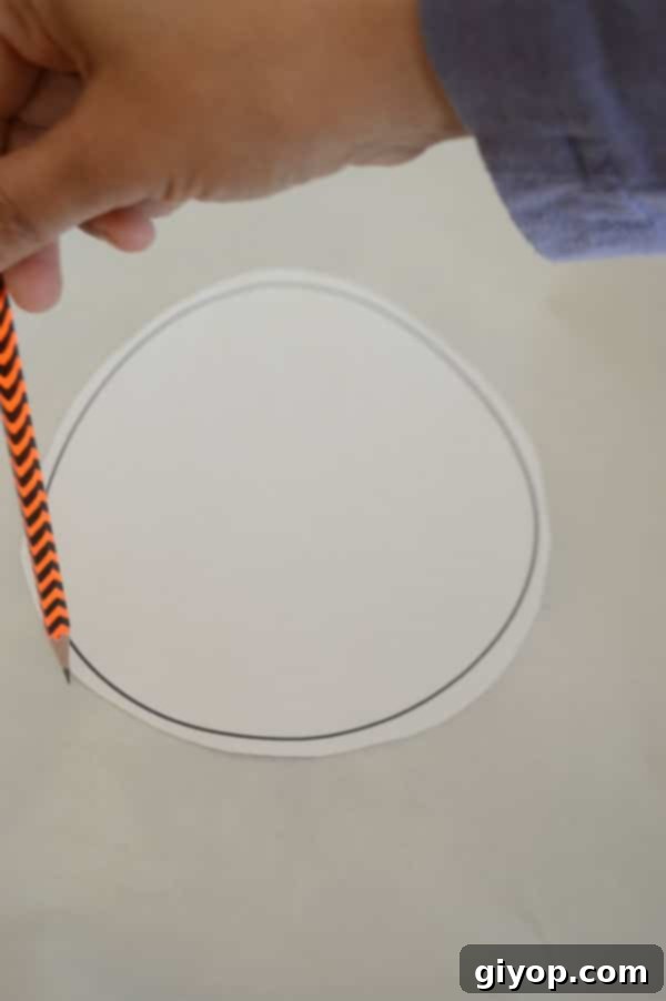 Hand drawing circle on a paper