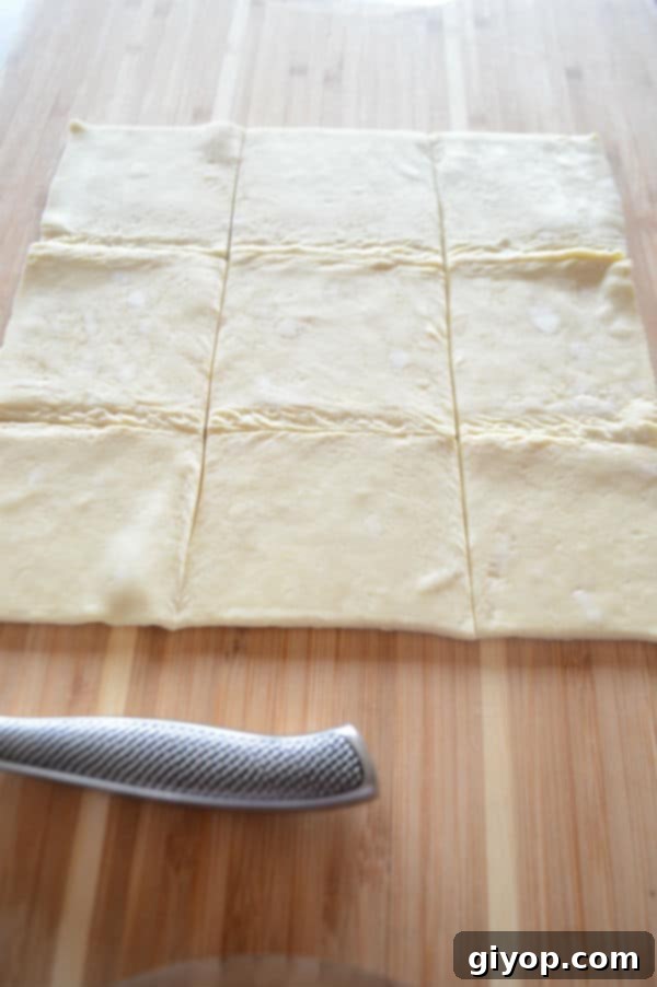 A cut dough on a wooden table and knife