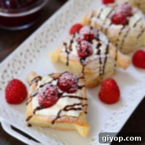 Raspberry danish served with fresh rapberries and dusted with powdered sugar.
