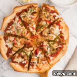 An overhead image of chicken fajita pizza, showing the rich toppings and golden crust.