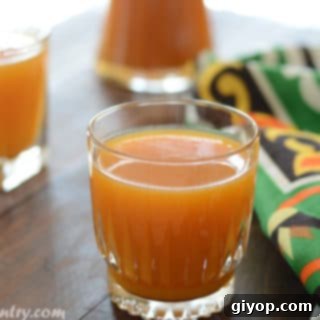 A close up of glass of apricot juice
