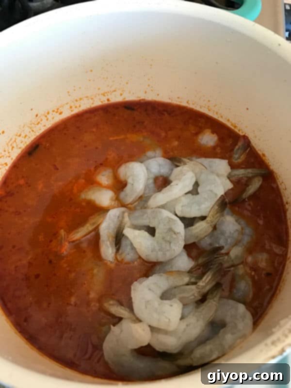 Shrimps being added to the pot