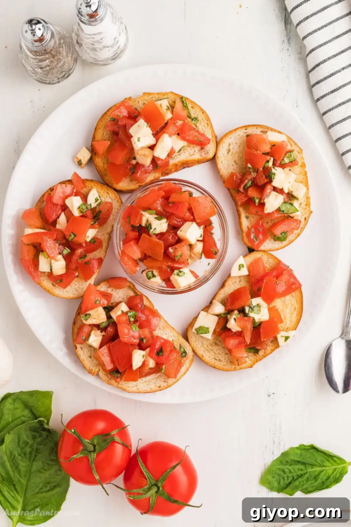 An overhead image of bruchetta with mozzarella.