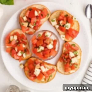 Bruschetta with mozzarella on bread slices.