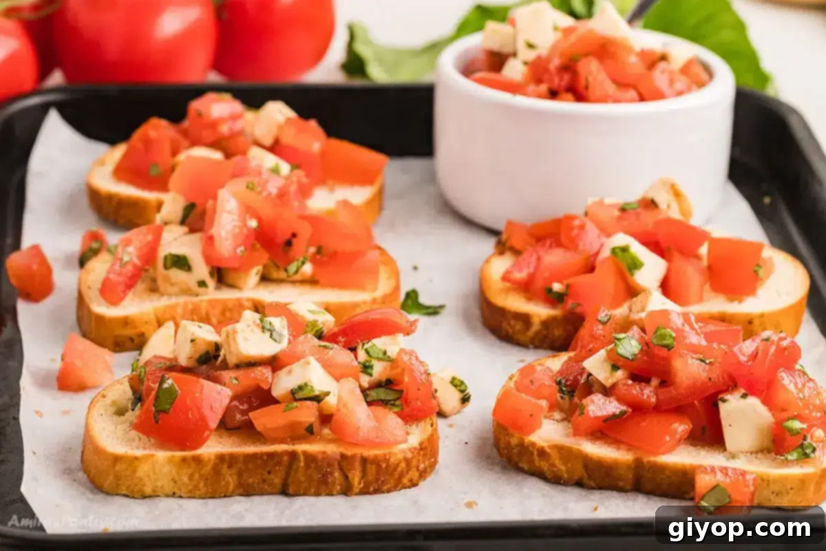 Bruschetta toast with mozzarella on a baking sheet.