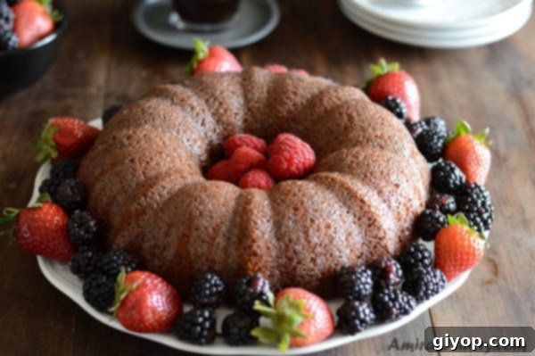 Caramelized Milk Powder Cake 4 A plate of food on a table, with powdered Cake and berries