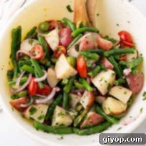 Zesty Italian Potato Salad 4 A bowl with Italian potato salad.