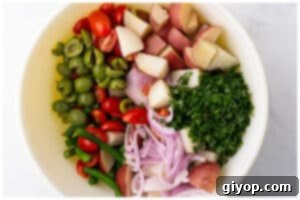 Zesty Italian Potato Salad 10 All salad ingredients in a large bowl before dressing.